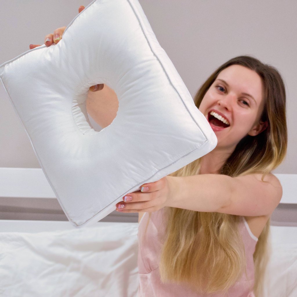 mono pillow in hands